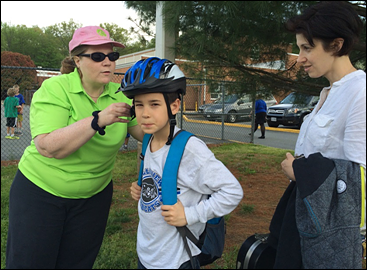 A student at Belle View Elementary School is fitted for a helmet.